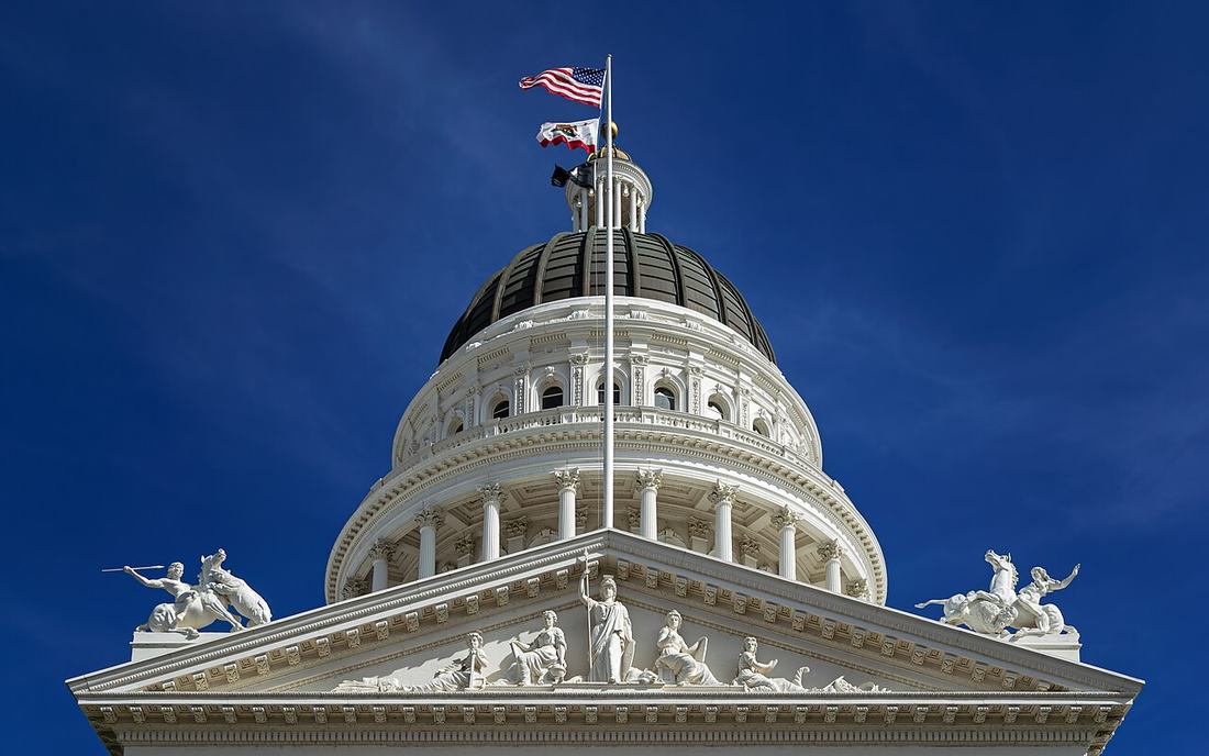 California State Capitol dome against a blue sky