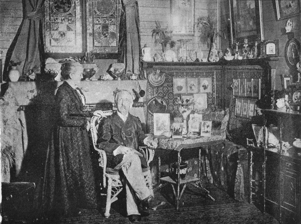 Elderly couple photographed in their sitting room