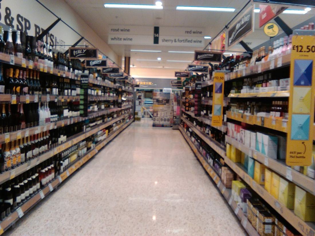 Supermarket aisle with shopping carts