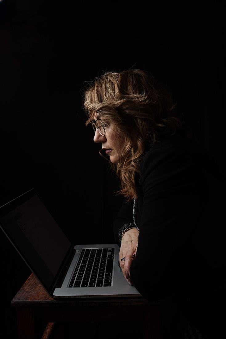 Woman working on a laptop at a desk