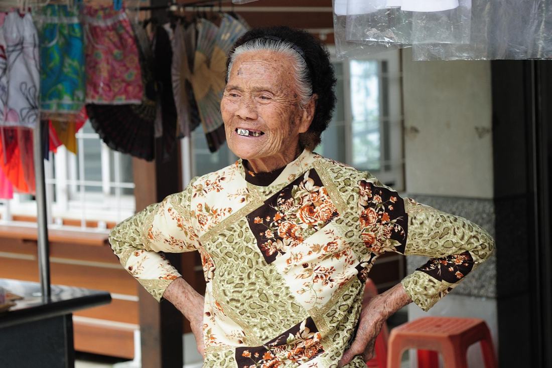 Smiling older woman outdoors