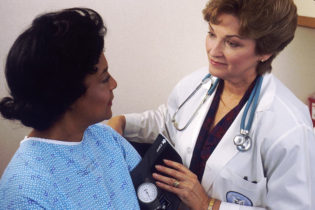 Doctor taking a patient's blood pressure