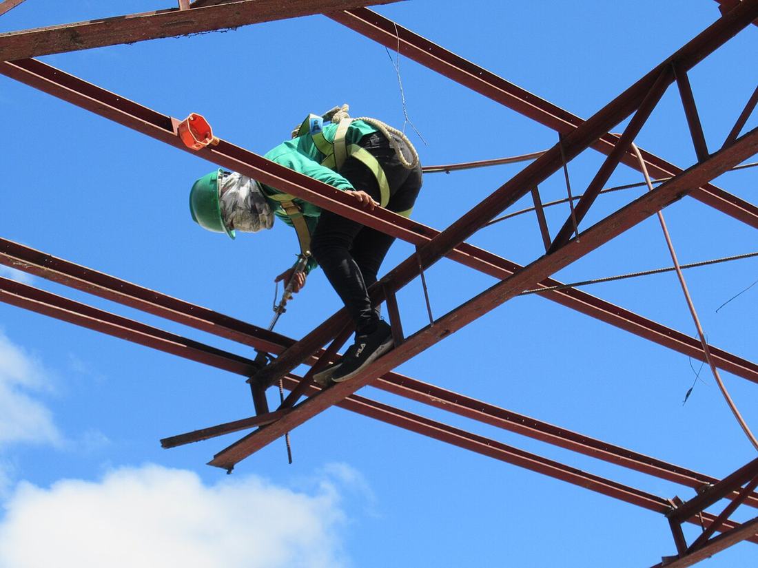 Welder working on steel beams